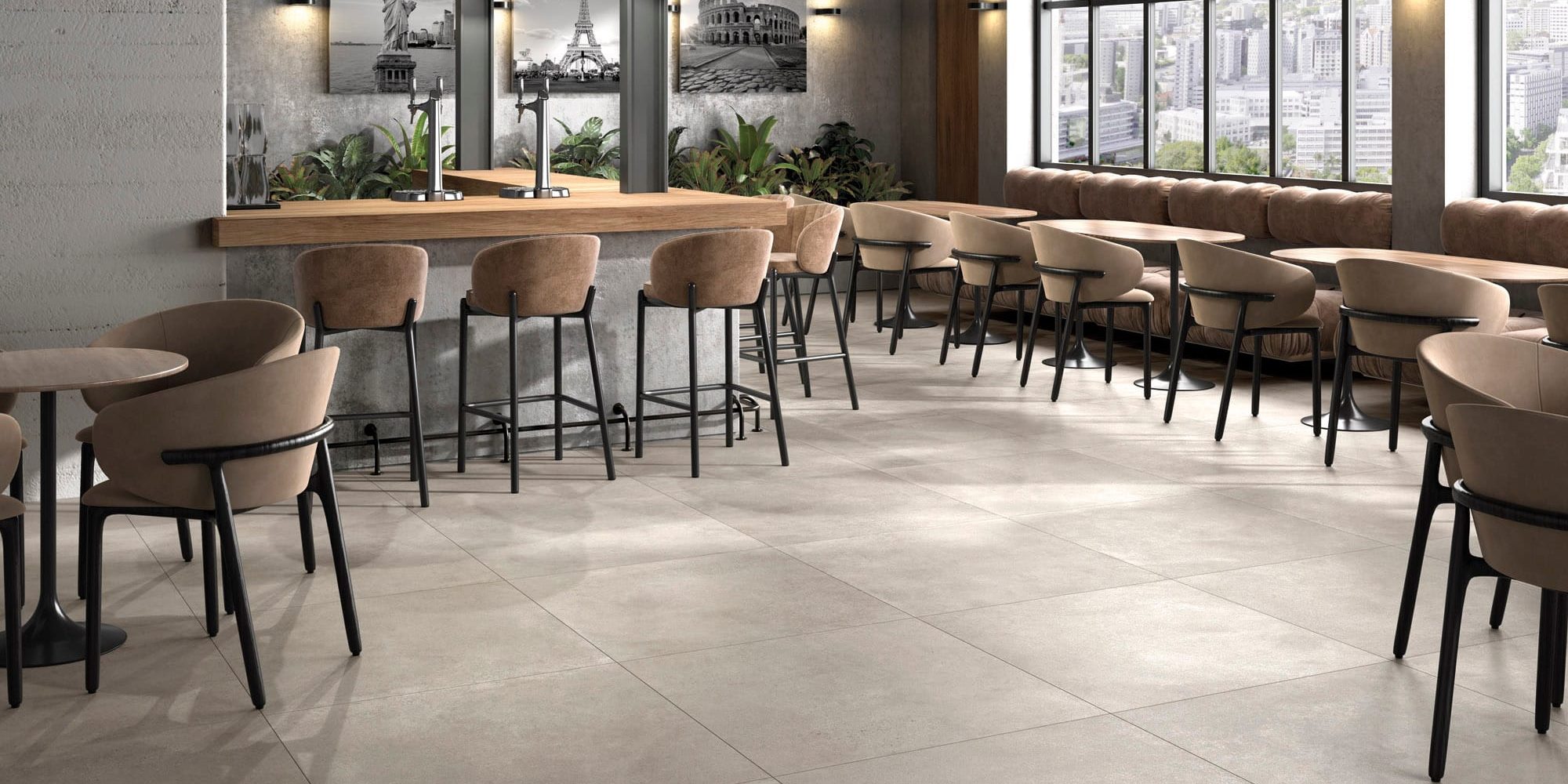 Tegels voor horeca in een restaurantzaal met grote betonlook vloertegels