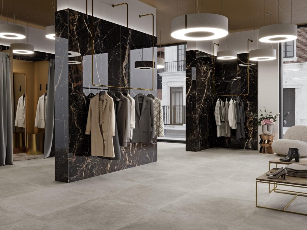 Lux laurants - Winkel en showroom met zwarte marmerlook en lichte betonlook op wand en vloer, Pamesa