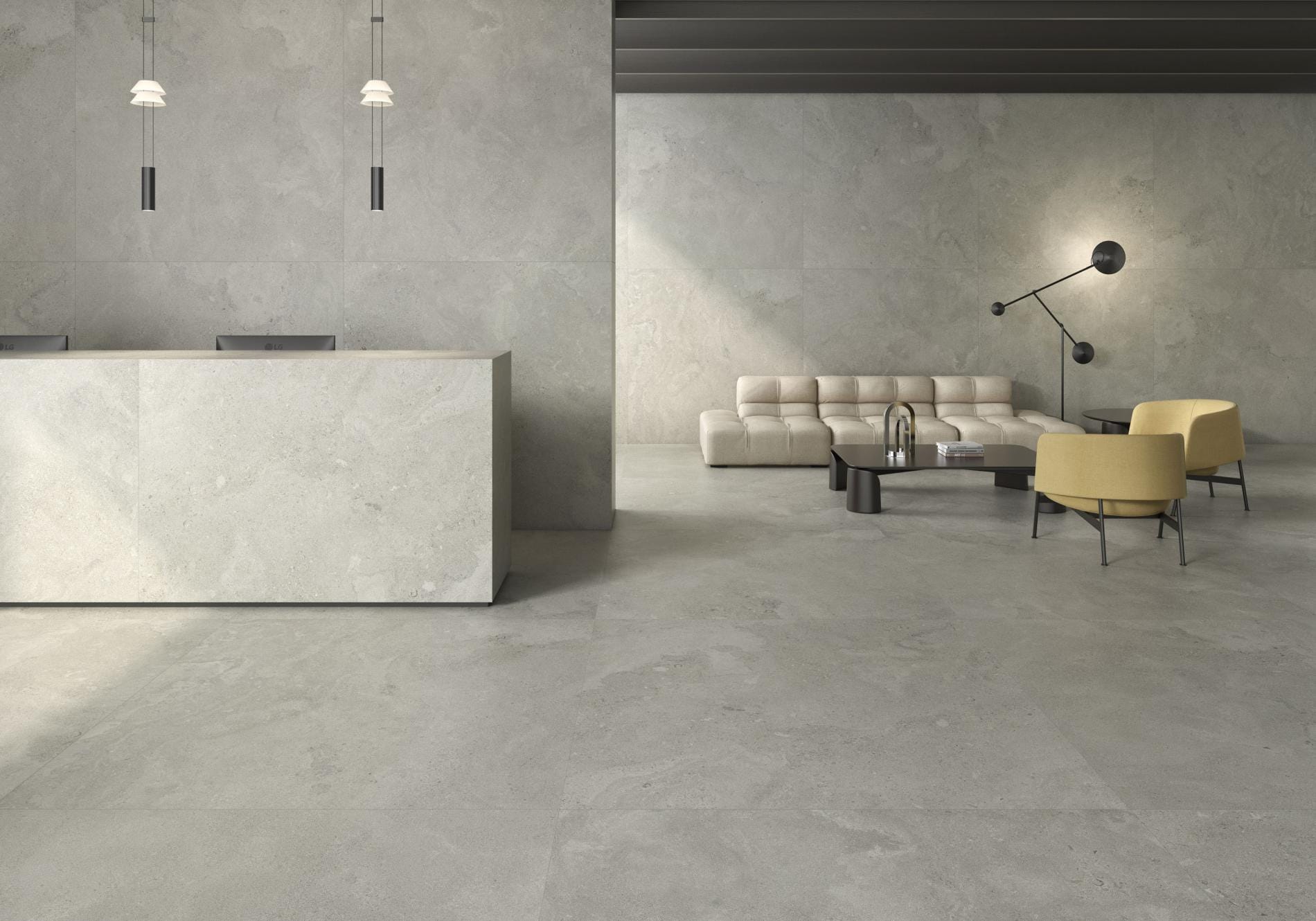 Portlandstone - Hotelreceptie en kantoor met grijze betonlook op vloer en balie, Pamesa