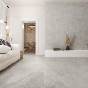 Souland - Woonkamer en keuken met lichte betonlook op vloer en wand, Pamesa